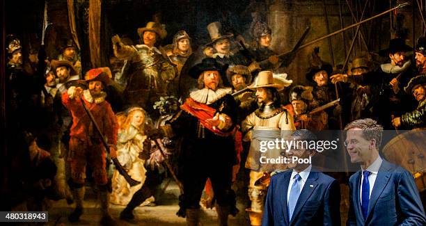 President Barack Obama and Prime Minister of the Netherlands Mark Rutte pose for photographs during a press conference in front of Rembrandt's 'The...