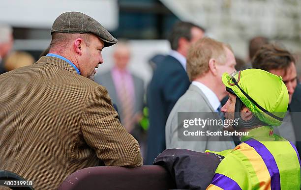 Trainer Peter Moody speaks to Damien Oliver after Oliver rode El Greco in race 1 the Taj Rossi Series Final during Flemington Finals Day at...