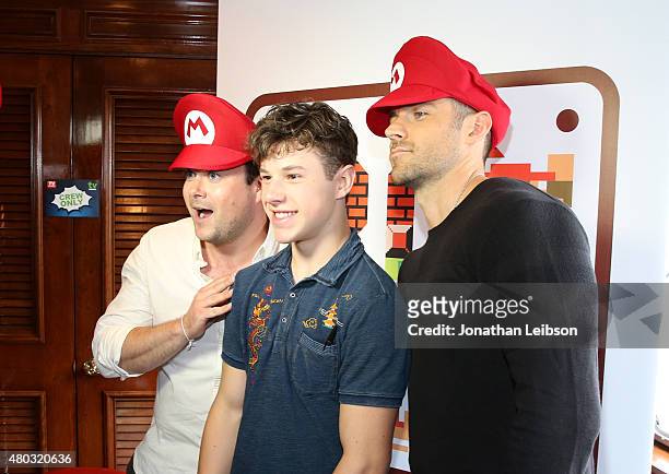 Actor Nolan Gould and __ attend The Nintendo Lounge on the TV Guide Magazine yacht during Comic-Con International 2015 on July 10, 2015 in San Diego,...
