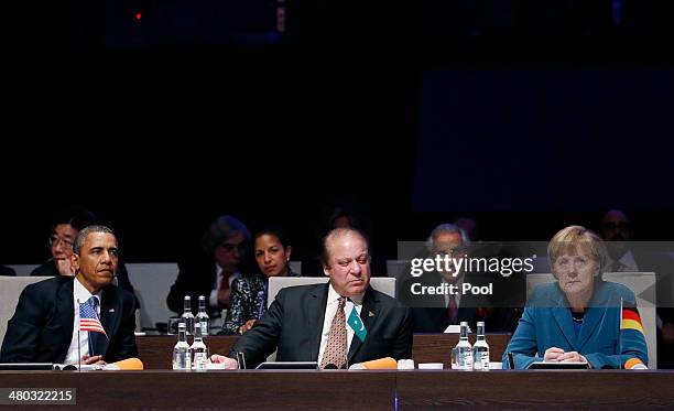 President Barack Obama, Pakistan's Prime Minister Nawaz Sharif and Germany's Chancellor Angela Merkel attend the opening session of the at the 2014...