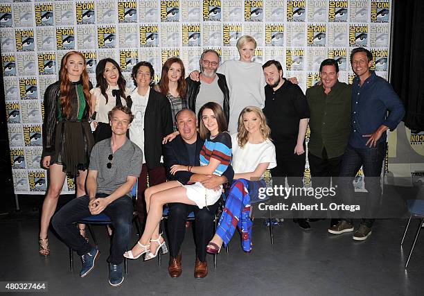 The cast pose backstage at the "Game of Thrones" panel during Comic-Con International 2015 at the San Diego Convention Center on July 10, 2015 in San...