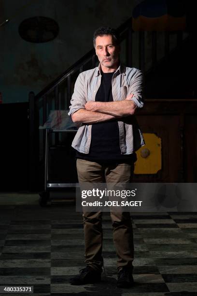 British artist Bruce Clarke poses, on March 24, 2014 in Paris, prior to take part in a press conference focused on his art project "Les Hommes...