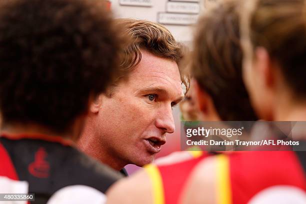 EsEssendon ach James Hird speaks with his players during the round 15 AFL match between the Essendon Bombers and the Melbourne Demons at Melbourne...