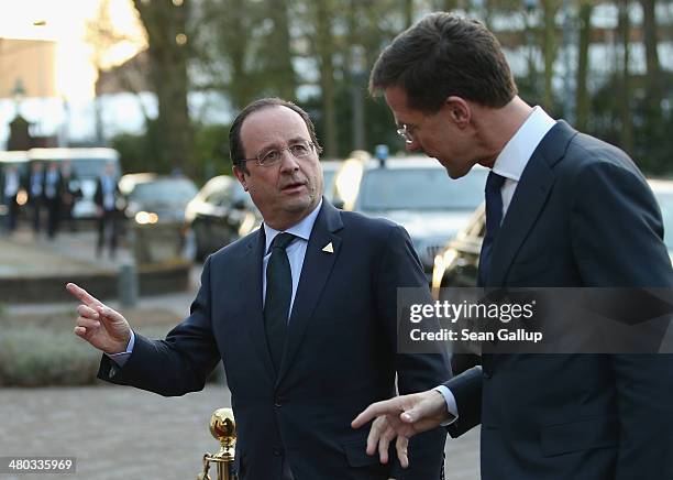 French President Francois Hollande chats with Dutch Prime Minister Mark Rutte upon arriving for a meeting of G7 leaders on March 24, 2014 in The...