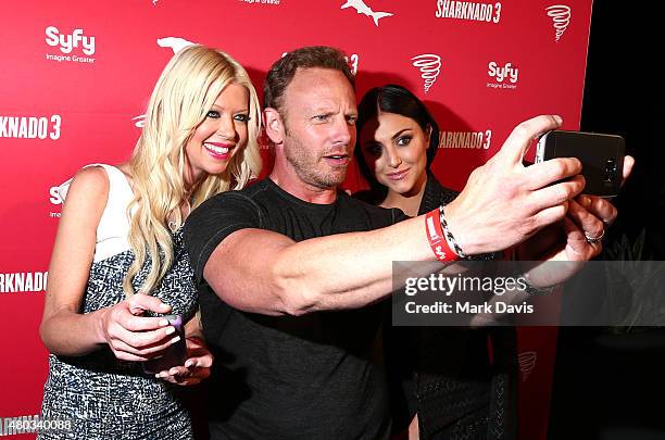 Actors Tara Reid, Ian Ziering and Cassie Scerbo take a selfie at the "Sharknado 3" Party during Comic-Con International 2015 at Hotel Solamar on July...