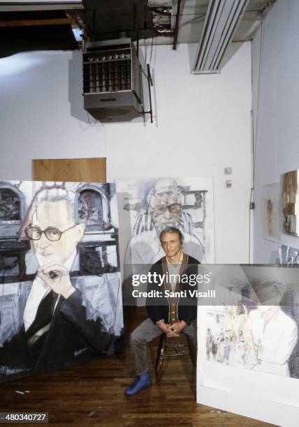 Painter Larry Rivers with portraits of Primo Levi on February 10, 1988 in New York, New York.