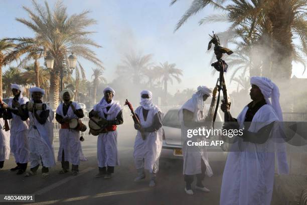 Supporters greet Ali Benflis as he arrives in Adrar, 1 400 km southwest of the capital Algiers, as campaigning kicks off in Algeria for the April 17...