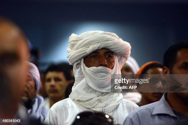 Supporters of Ali Benflis listen to him speak in to Adrar, 1 400 km southwest of the capital Algiers, as campaigning kicks off in Algeria for the...