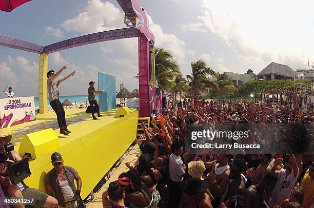 Jean Paul Makhlouf, Alex Makhlouf, and Samuel Frisch of Cash Cash spin onstage at mtvU Spring Break 2014 at the Grand Oasis Hotel on March 21, 2014...