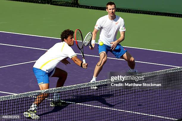Robin Hasse of Netherlands and Jonathan Marray of Great Britain play Daniel Nestor of Canada and Nenad Zimonjic of Serbia during the Sony Open at the...