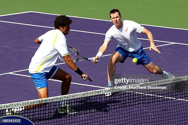 Robin Hasse of Netherlands and Jonathan Marray of Great Britain play Daniel Nestor of Canada and Nenad Zimonjic of Serbia during the Sony Open at the...