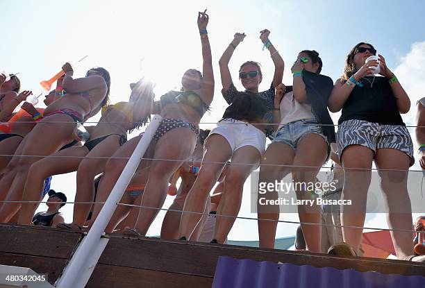 Spring breakers attend mtvU Spring Break 2014 at the Grand Oasis Hotel on March 21, 2014 in Cancun, Mexico. "mtvU Spring Break" starts airing March...