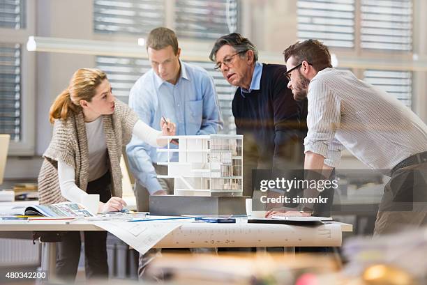 architect explaining project plan to client - architecture model stock pictures, royalty-free photos & images