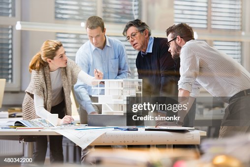 Architect explaining project plan to client Architect explaining project plan to client