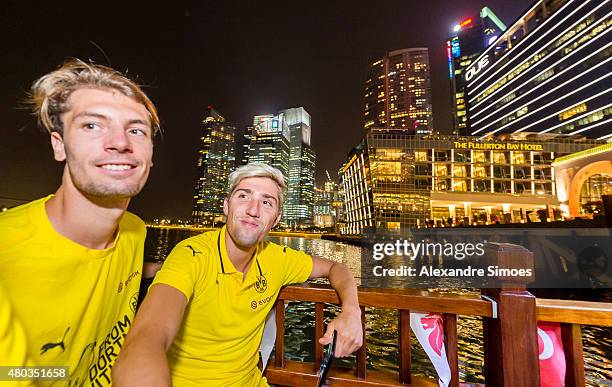 Jon Gorenc Stankovic and Kevin Kampl of Borussia Dortmund pose before the skyline of Singapore on July 10, 2015 in Singapore, Singapore.