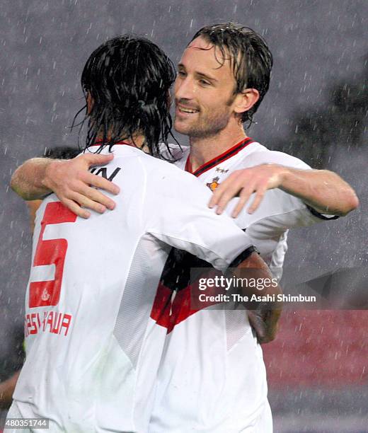 Joshua Kennedy of Nagoya Grampus celebrates scoring his team's second goal with his team mate Takahiro Masukawa during the J.League match between...