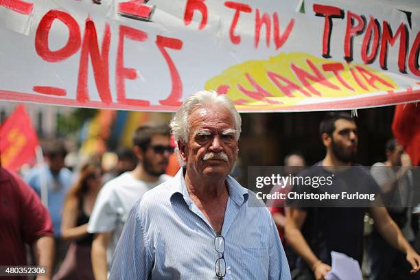Anti-austerity demonstrators, from the communist party, take part in a minor rally through the streets of Athens on July 11, 2015 in Athens, Greece....
