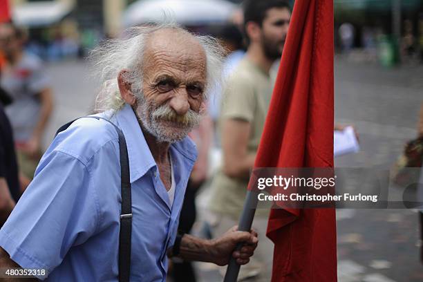 Anti-austerity demonstrators, from the communist party, take part in a minor rally through the streets of Athens on July 11, 2015 in Athens, Greece....