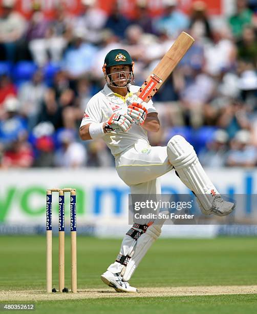 Australia batsman David Warner hits out during day four of the 1st Investec Ashes Test match between England and Australia at SWALEC Stadium on July...