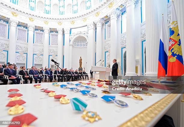 Russian President Vladimir Putin speaks during a state award ceremony for the participants of the Olympic and Paralympics Games in Sochi in the...