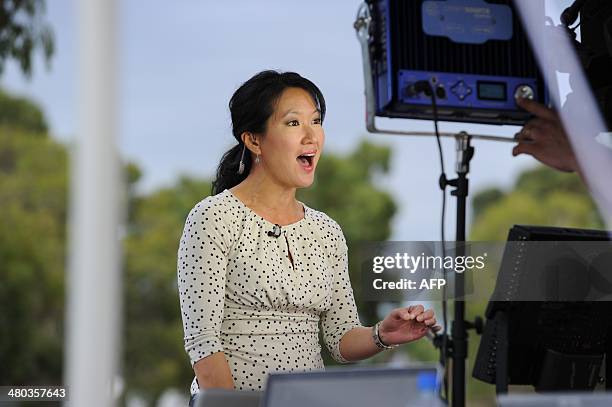 Correspondent Kyung Lah speaks on camera at Pearce Airbase in Bullsbrook, 35 kms north of Perth on March 25 during media coverage of the air and sea...