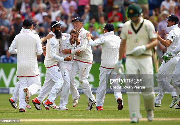 Mark Wood of England celebrates after taking the wicket of Adam Voges of Australia during day four of the 1st Investec Ashes Test match between...