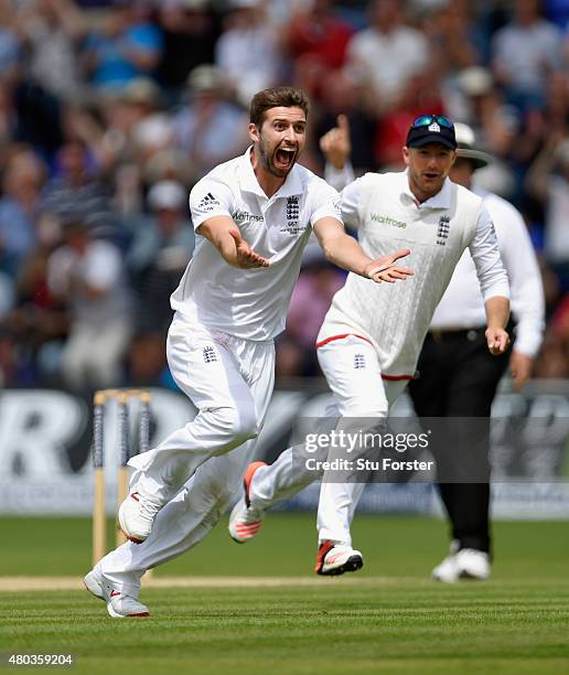 England bowler Mark Wood celebrates after dismissing Australia batsman Adam Voges during day four of the 1st Investec Ashes Test match between...