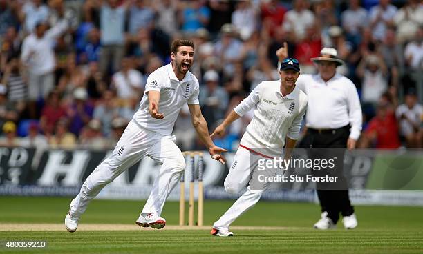 England bowler Mark Wood celebrates after dismissing Australia batsman Adam Voges during day four of the 1st Investec Ashes Test match between...