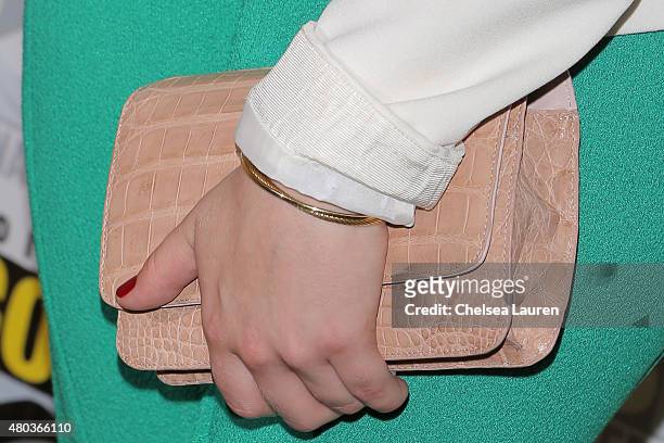 Actress Eliza Taylor, clutch detail, attends the 'The 100' press room during day 2 of Comic-Con International on July 10, 2015 in San Diego,...