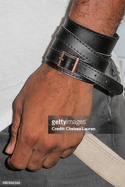 Actor Ricky Whittle, bracelet detail, attends the 'The 100' press room during day 2 of Comic-Con International on July 10, 2015 in San Diego,...