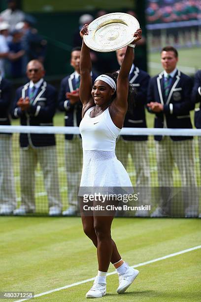 Serena Williams of the United States celebrates with the Venus Rosewater Dish after her victory in the Final Of The Ladies' Singles against Garbine...
