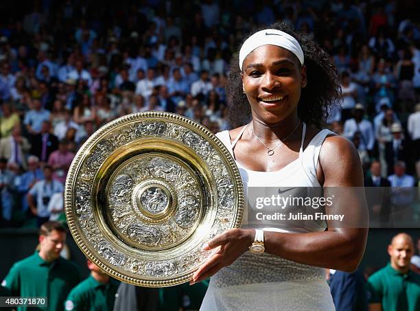 Serena Williams of the United States celebrates with the Venus Rosewater Dish after her victory in the Final Of The Ladies' Singles against Garbine...