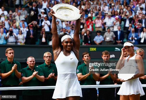 Serena Williams of the United States celebrates with the Venus Rosewater Dish after her victory in the Final Of The Ladies' Singles against Garbine...