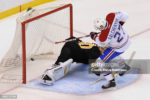 Alex Galchenyuk of the Montreal Canadiens scores and wins in a shootout against Tuukka Rask of the Boston Bruins at the TD Garden on March 24, 2014...