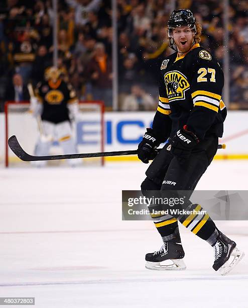 Dougie Hamilton of the Boston Bruins celebrates an assist on his teams goal in the third period against the Montreal Canadiens during the game at TD...