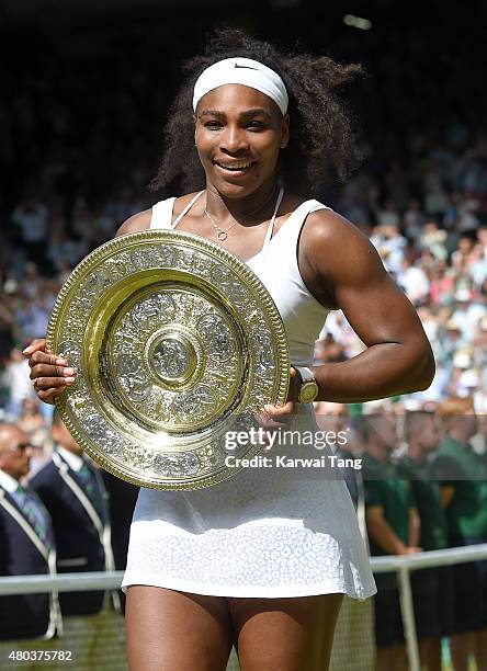 Serena Williams celebrates with the Venus Rosewater Dish after her victory in the Final Of The Ladies' Singles against Garbine Muguruza of Spain...