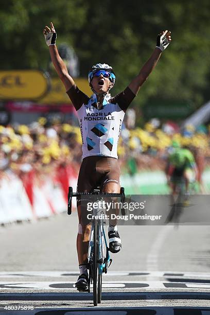 Alexis Vuillermoz of France and AG2R La Mondial Team celebrates victory as he crosses the finish line to win stage eight of the 2015 Tour de France,...