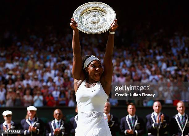 Serena Williams of the United States celebrates with the Venus Rosewater Dish after her victory in the Final Of The Ladies' Singles against Garbine...