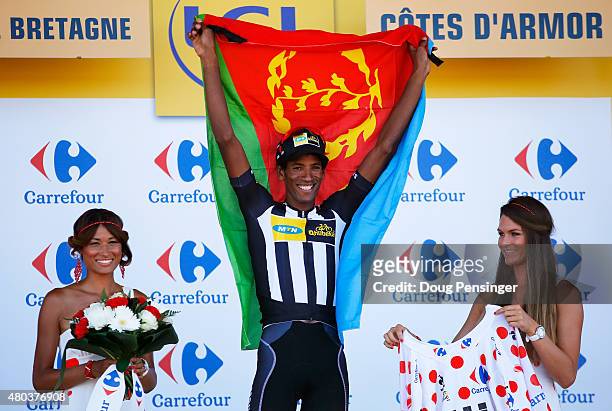 Daniel Teklehaimanot of Eritrea and MTN-Qhubeka celebrates retaining the polka dot jersey following stage eight of the 2015 Tour de France, a 181.5km...