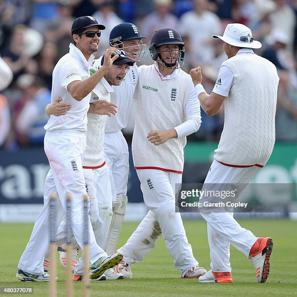 England captain Alastair Cook celebrates with teammates Adam Lyth, Jos Buttler and Gary Ballance after winning the 1st Investec Ashes Test match...