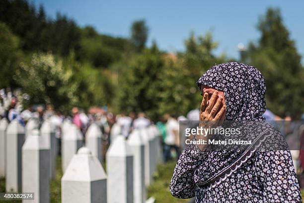 Woman mourns after the mass funeral for 136 newly-identified victims of the 1995 Srebrenica massacre attended by tens of thousands of mourners during...