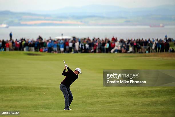 Justin Rose of England hits an approach shot on the second hole during the third round of the Aberdeen Asset Management Scottish Open at Gullane Golf...