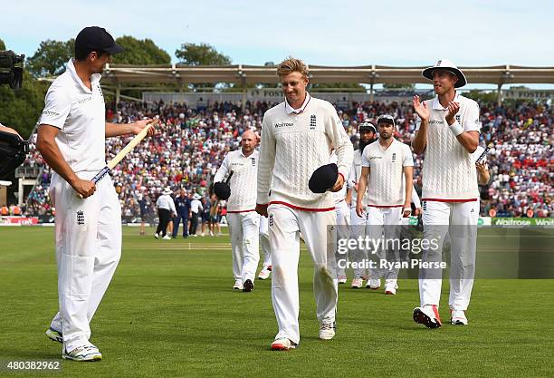 Alastair Cook, Joe Root and Stuart Broad of England walk from the ground after day four of the 1st Investec Ashes Test match between England and...