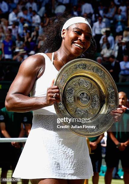 Serena Williams of the United States celebrates with the Venus Rosewater Dish after her victory in the Final Of The Ladies' Singles against Garbine...