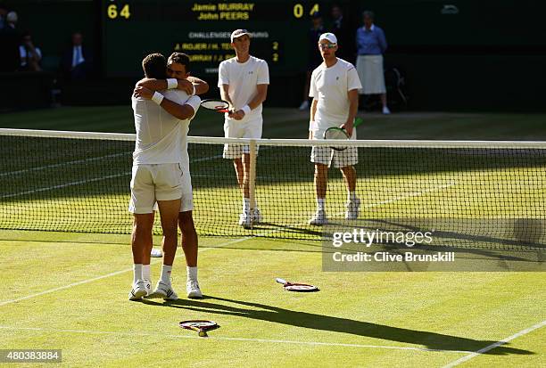 Jean-Julien Rojer of Netherlands and Horia Tecau of Romania celebrate after winning the Final Of The Gentlemen's Doubles against John Peers of...