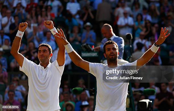 Jean-Julien Rojer of Netherlands and Horia Tecau of Romania celebrate after winning the Final Of The Gentlemen's Doubles against John Peers of...