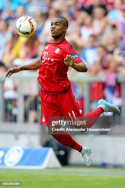 Douglas Coste battles for the ball during a FC Bayern Muenchen training session after the FC Bayern Muenchen season opening and team presentation at...