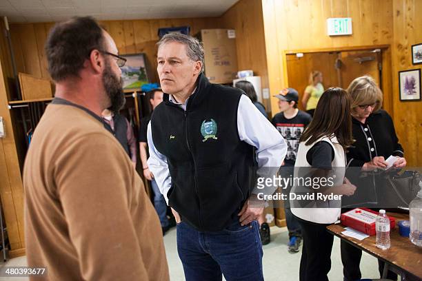 Washington Governor Jay Inslee speaks with Greg Regelbrugge at a temporary Red Cross shelter at the Darrington Community Center on March 24, 2014 in...