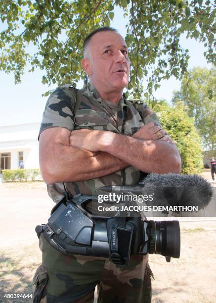 Chief warrant officer Laurent, from the French Army Communications Audiovisual Office , rests between rehearsals of the French national Bastille Day...