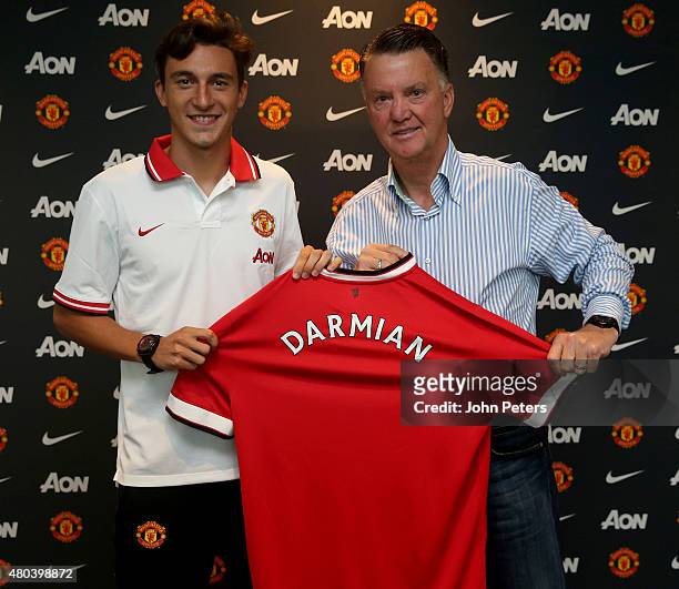 Matteo Darmian of Manchester United poses with Manager Louis van Gaal after signing for the club at Aon Training Complex on July 11, 2015 in...